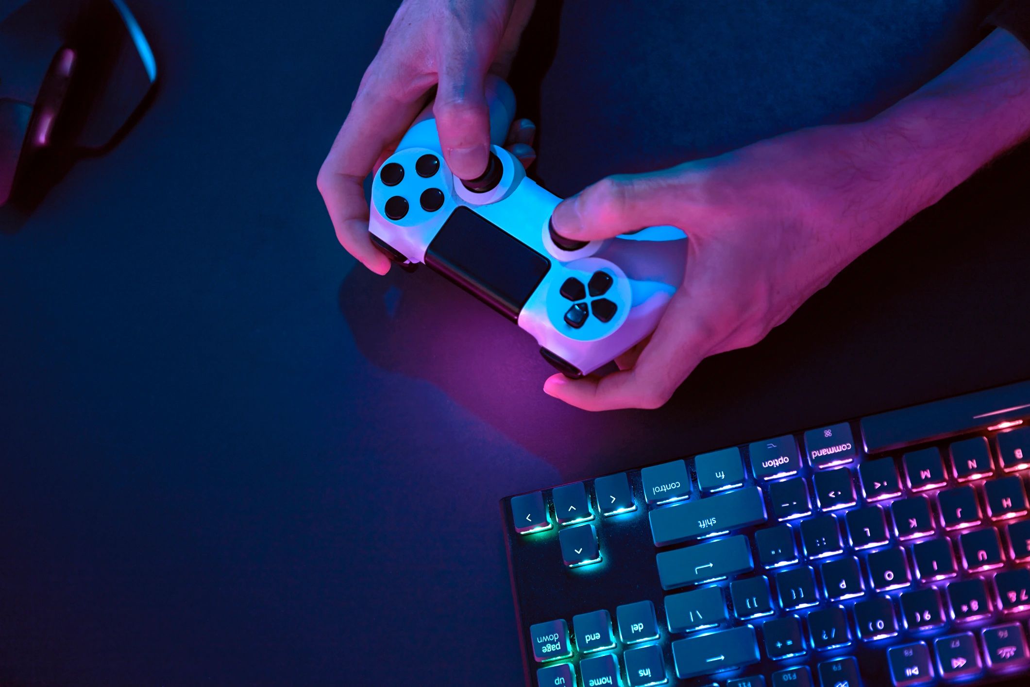 Male hands using controller for controlling computer.