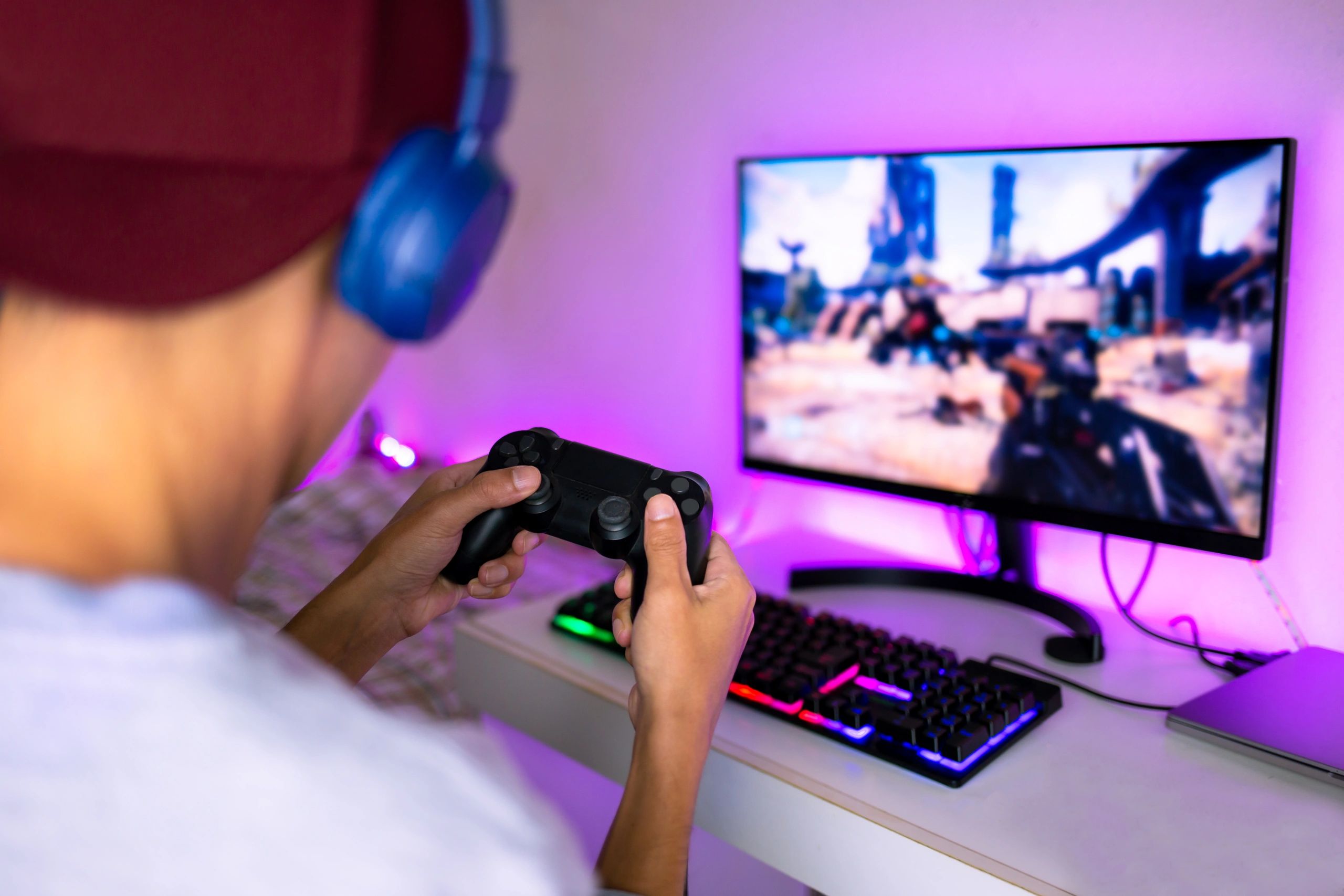 Young man playing video games on the computer